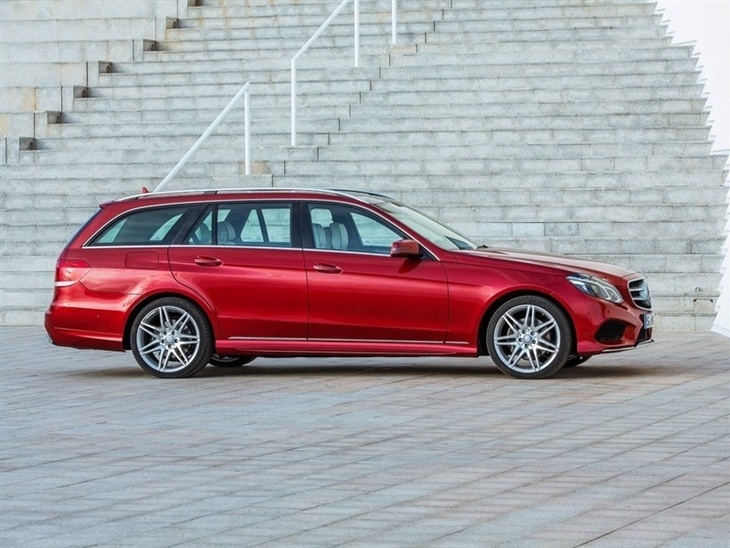 The side of a Mercedes Benz E Class Estate in Red