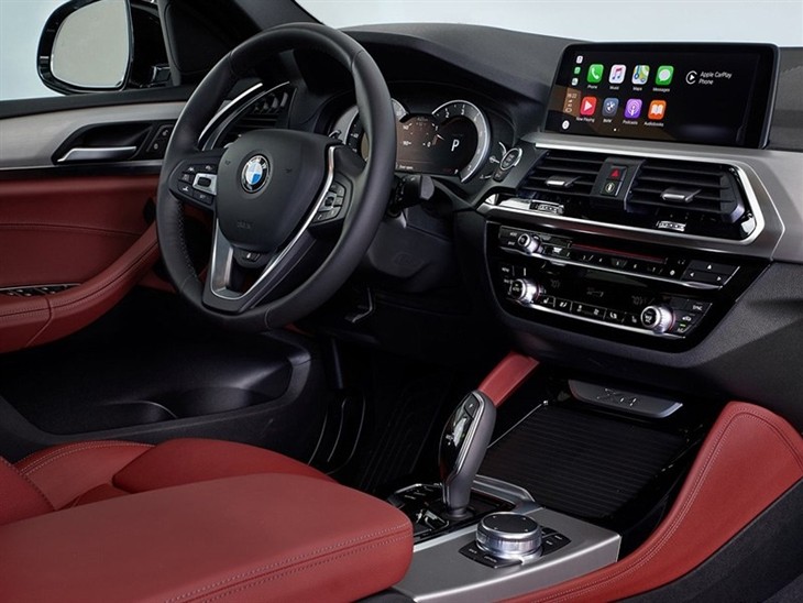 BMW X4 2019 Promo interior view of console and steering wheel digital screen and controls