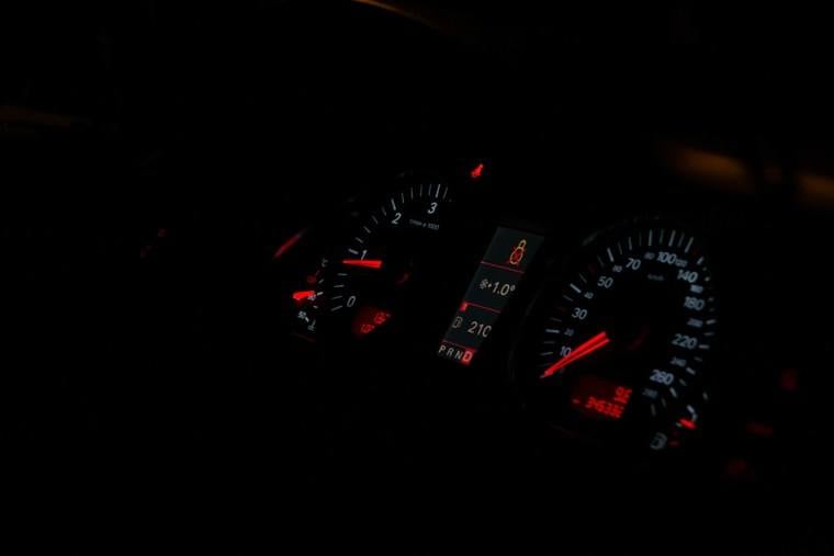 Car instrument panel with red lights