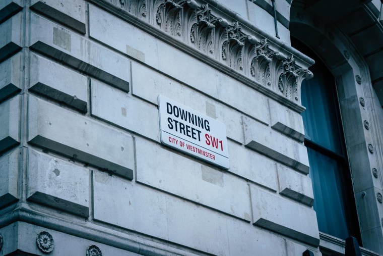 Downing Street sign on wall