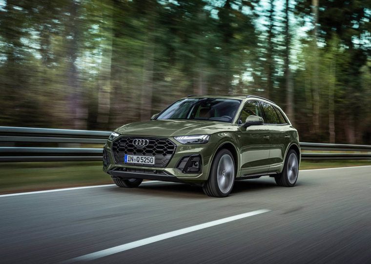 Audi Q5 in green driving on the road