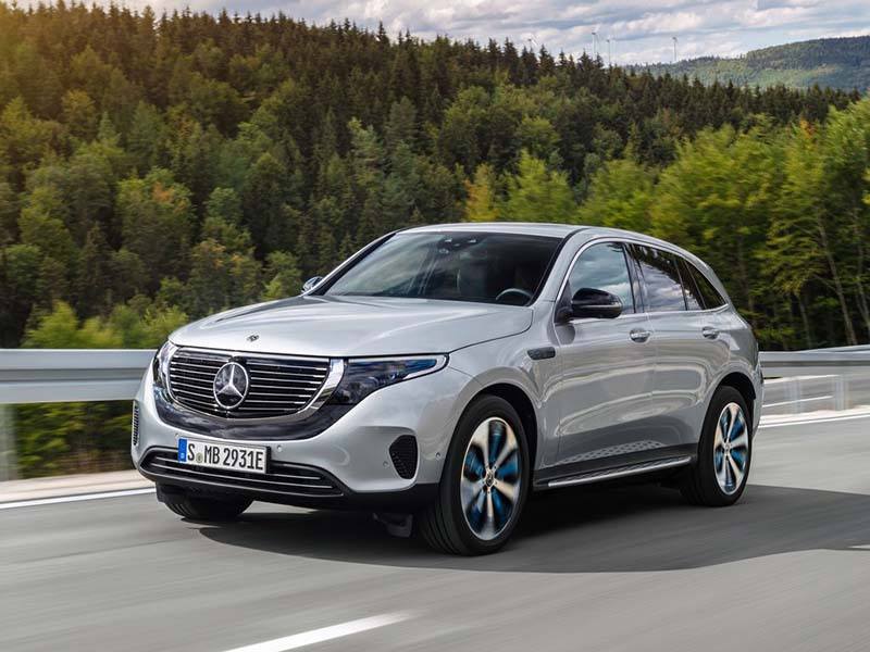 grey mercedes-benz eqc driving on the road