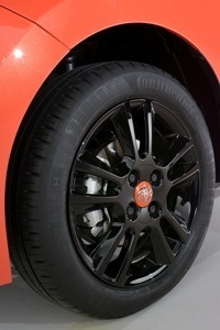 15-inch gloss black alloys with an orange centre cap on the new Toyota Aygo x-cite 15-inch gloss black alloys with an orange centre cap on the new Toyota Aygo x-cite