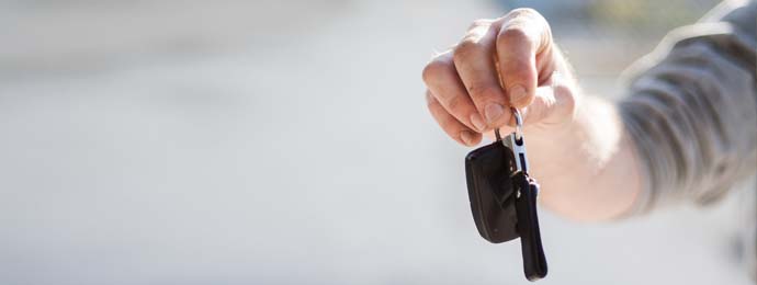 man holding car keys