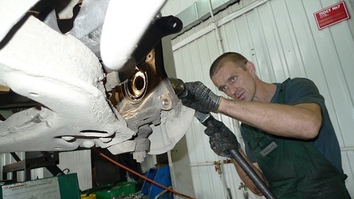 Mechanic working on a car service Mechanic working on a car service