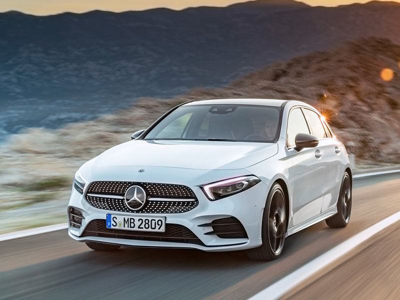white mercedes-benz a-class hatchback driving on road