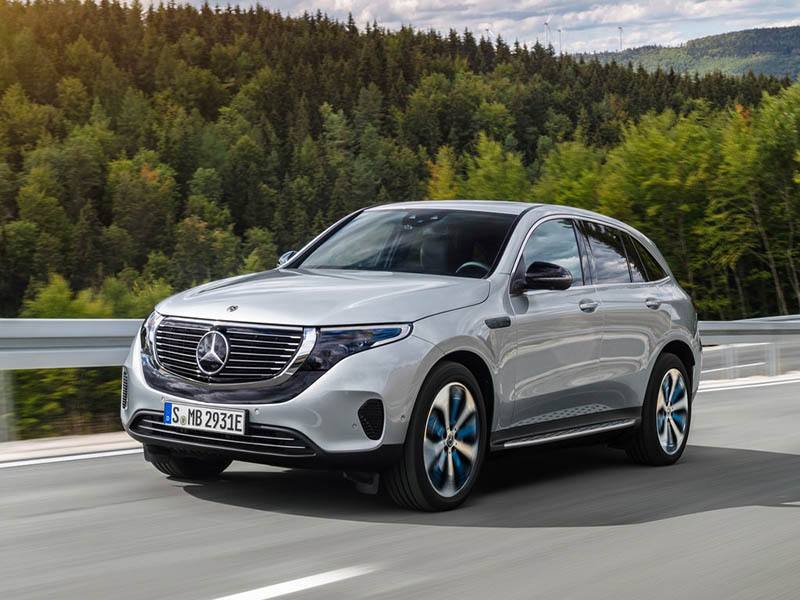 silver mercedes-benz eqc driving on country road