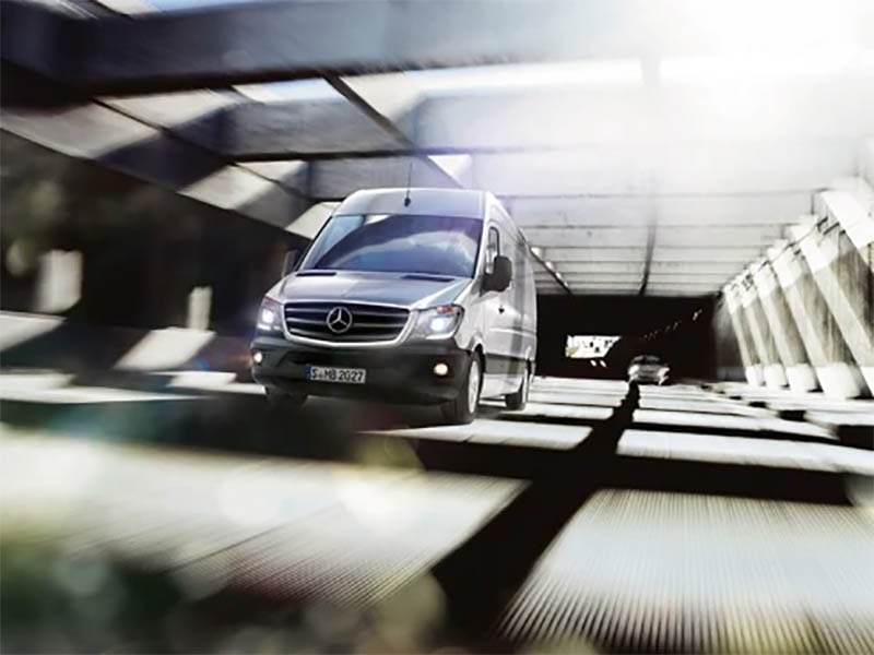 silver mercedes-benz sprinter driving on road