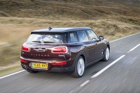 Rear View of the New MINI Clubman on the road Rear View of the New MINI Clubman on the road