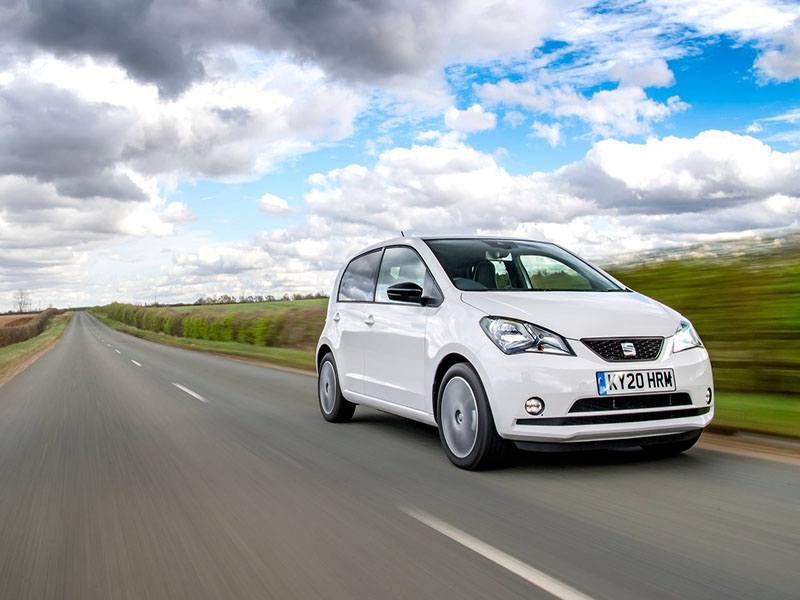 white seat mii electric driving on road