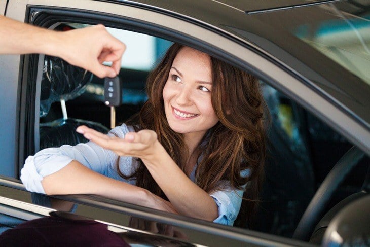 Young Driver getting car keys after passing a driving test