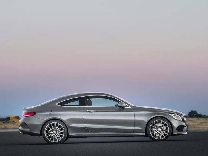 A Side view of A Mercedes Benz C-Class Coupe in Silver