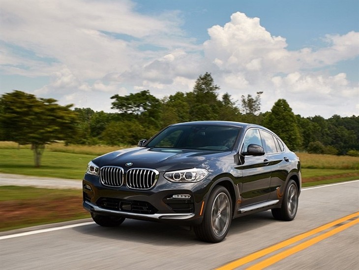 BMW X4 2019 Promo driving front left view in dark metal highway road