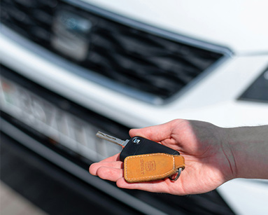a person holding a key in their hand