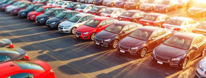 Car park full of cars at sunset