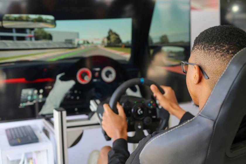 a man playing a video game on a computer