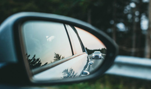 Close-up shot of a car wing mirror rear view