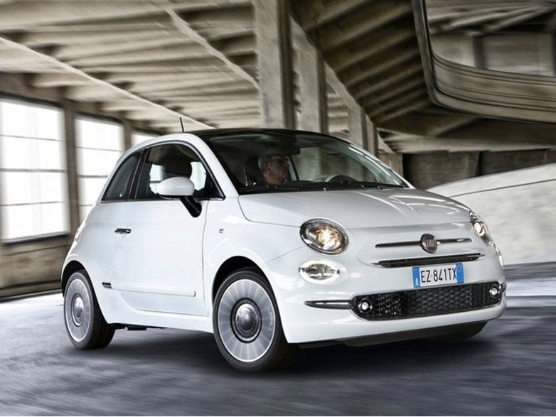 white fiat 500 hatchback driving