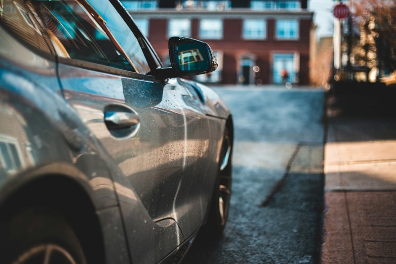 Black car on a road during daytime