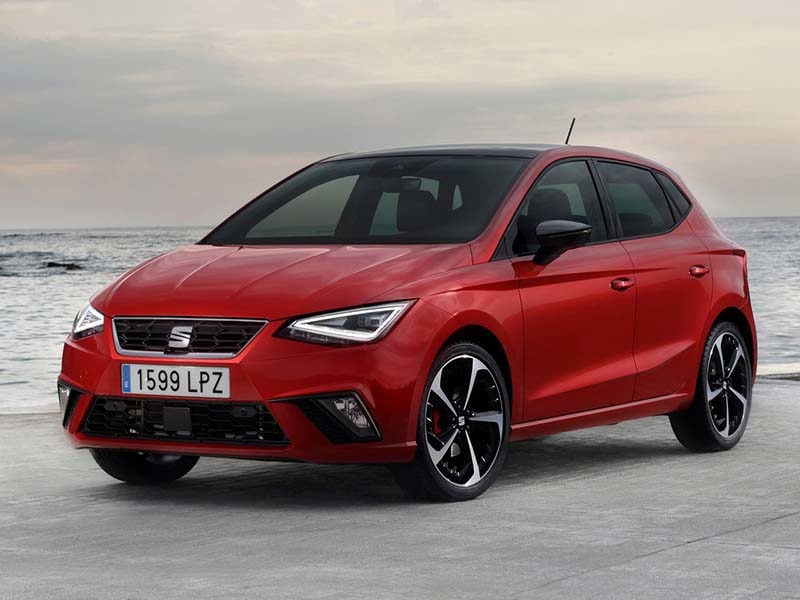 Red Seat Ibiza next to the ocean