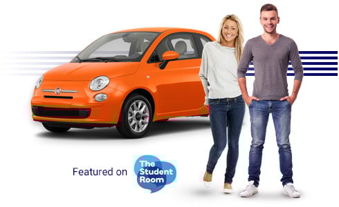 A young couple standing by a city car.