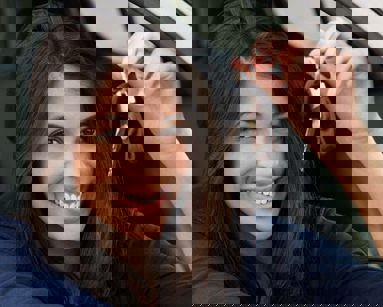 young woman holding car key