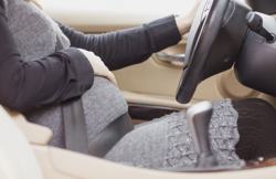 Pregnant woman sitting in car correctly