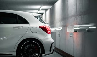 white mercedes in car park