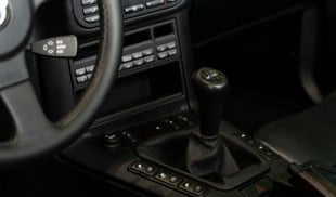 a steering wheel and dashboard of a car