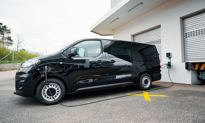 black van parked at garage