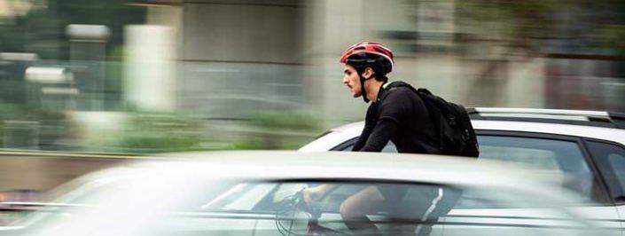 man riding a bike with helmet on
