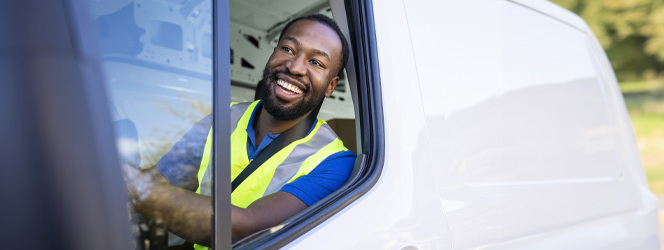 man making deliveries from his cargo van on a sunny day