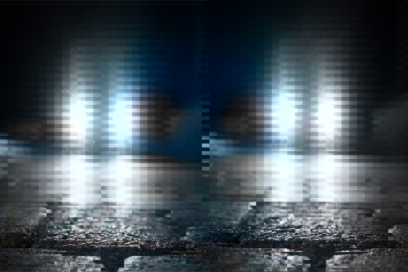 bright vehicle headlight on the street
