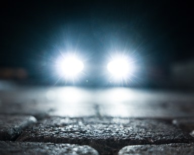 bright vehicle headlight on the street