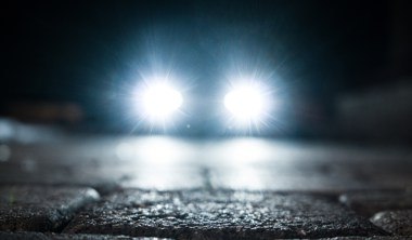bright vehicle headlight on the street