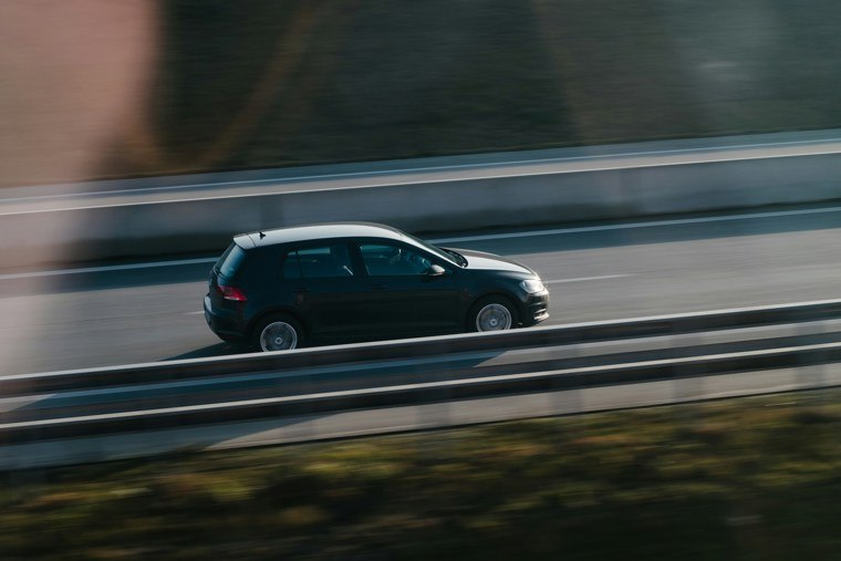 Black Volkswagen driving on the motorway