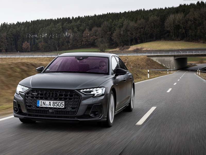 grey audi a8 saloon driving on road