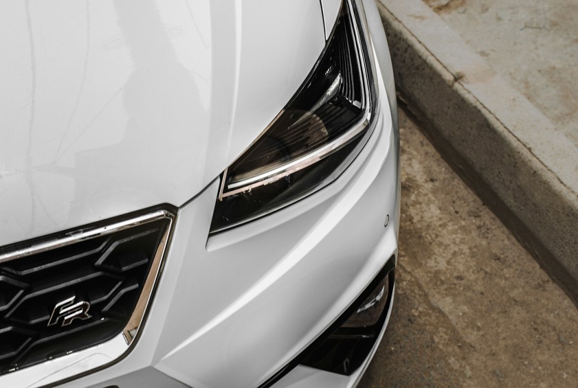 a white car parked on the side of the road