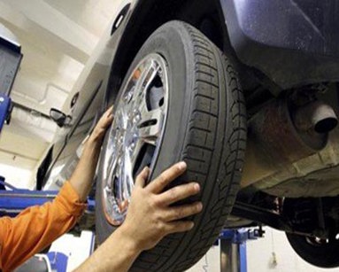 close up of mechanic changing a tyre