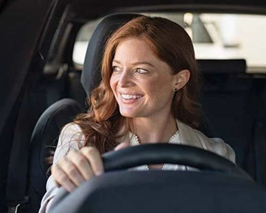 woman driving a hybrid car