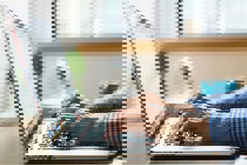 person typing on computer