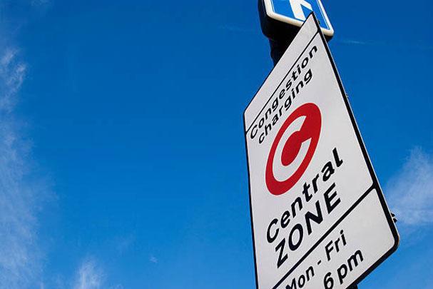 congestion charge sign with sky in background 