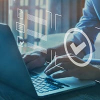 close up of man typing on laptop