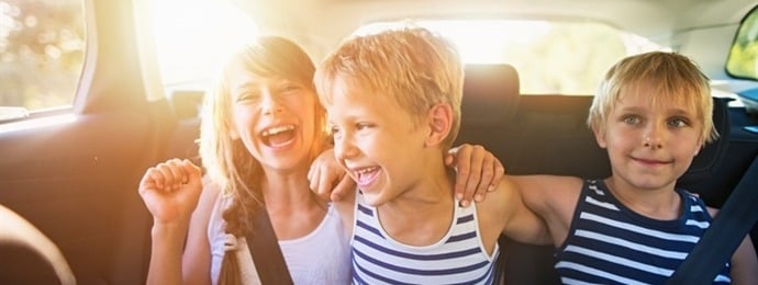 young children in the back of a car