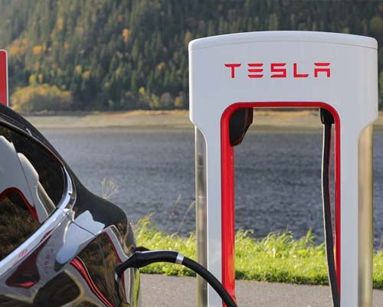tesla charging at supercharger