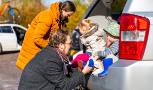 Happy family getting ready for a day out