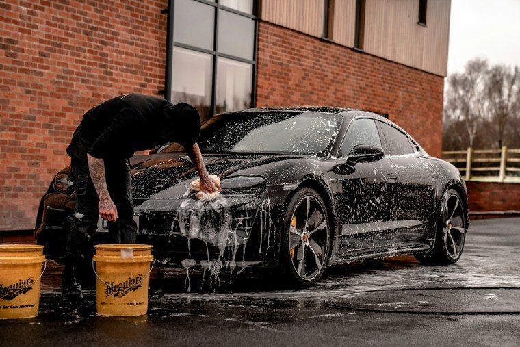 person washing car