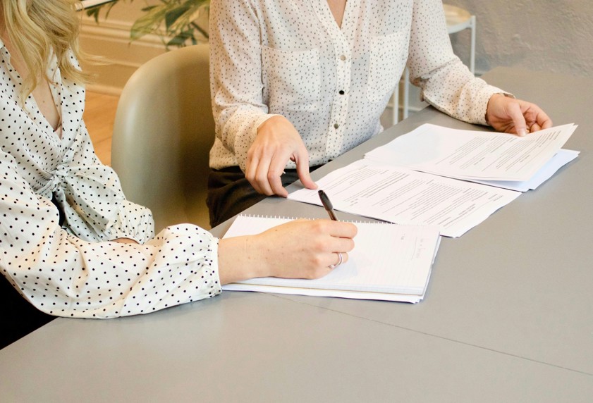 woman signing documents