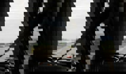 Person driving car with seatbelt on