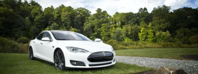 white tesla on country lane